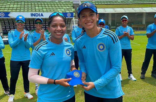 Smriti Mandhana hands over debut India cap to Minnu Mani. PC: BCCI